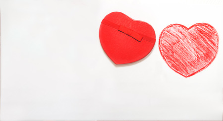Hand drawn, crayon heart shape and cover of heart shaped gift box isolated on white background.Holiday concept with isolated background.の写真素材