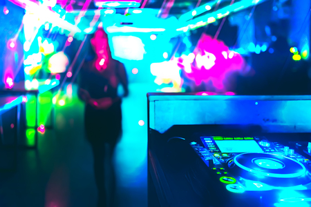 Blurry defocused view of stage and music tracks in darkness of party or night club.Copy space for text.の写真素材
