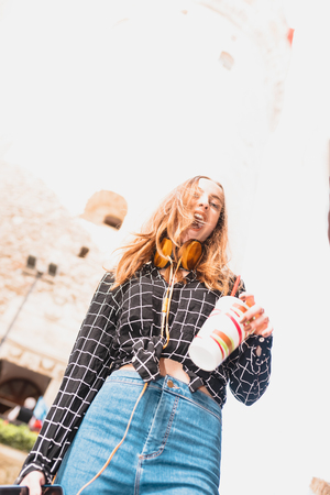 Portrait of beautiful attractive happy young trendy girl with view of Galata tower in Beyoglu,Istanbul,Turkeyの写真素材