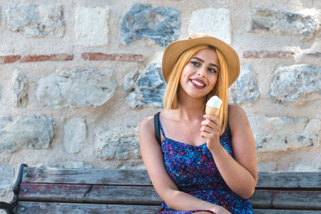 Beautiful traveler woman looks at traditional Turkish rug and carpets in Istanbul,Turkey.Traveler woman  lifestyle Concept.の写真素材