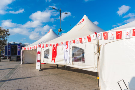 Exterior view of Turkish Red Crescent (Kizilay) blood donation team vehicle tent stand for people blood donation Istanbul,Turkey.16 November 2020のeditorial素材