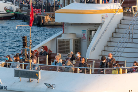 Unidentified Turkish people transport  in ferry docking at Emionu Pier in coronavirus COVID-19 epidemic.Istanbul,Turkey.16 November 2020のeditorial素材