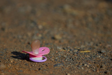 Pink baby pacifier.