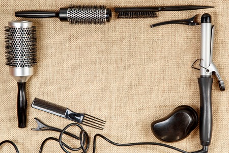 Tools hairdresser's top view on a beige backgroundの写真素材