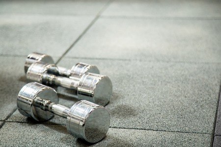 Dumbbells in modern sports club. Weight training equipmentの写真素材