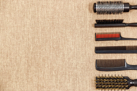 Tools hairdresser's top view on a beige background