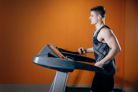 Young man on the treadmillの写真素材