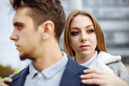 Portrait of young couple in love on the street.の写真素材