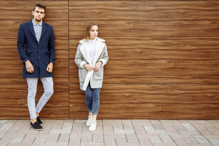 Young modern stylish couple in the city outdoorsの写真素材