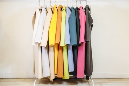Mix color row of female coats on hangersの写真素材