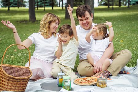 Happy family having fun together in natureの写真素材