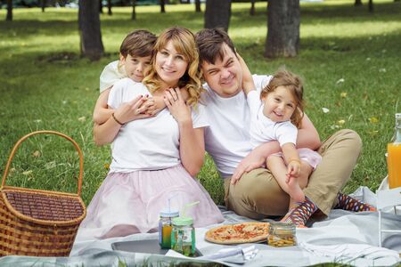 Happy family having fun together in natureの写真素材