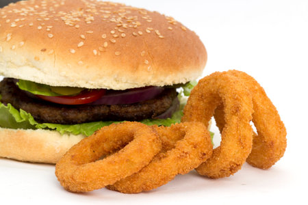 hamburgers and onion rings on a white background