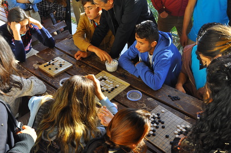 Antalya - Kas, TURKEY. OCTOBER 2016: Chinese game of go, baduk workshop with students, outdoor activity.のeditorial素材