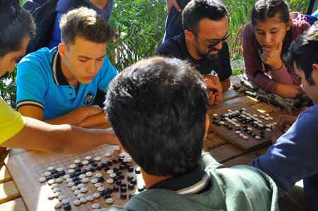 Antalya - Kas, TURKEY. OCTOBER 2016: Chinese game of go, baduk workshop with students, outdoor activity.のeditorial素材