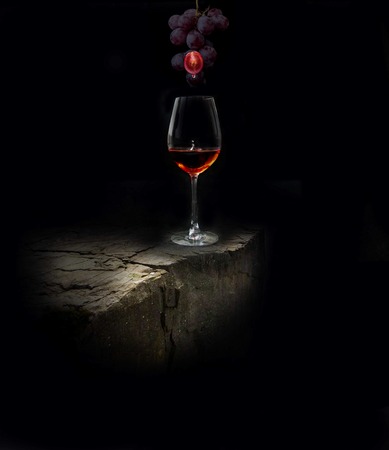 A glass of wine and berry is a grape catcherの写真素材