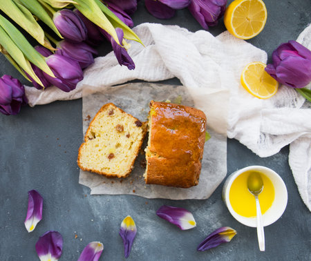 lemon cupcake and purple tulips