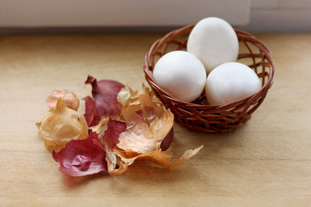 Preparation for Easter. One of the ways of coloring eggs. Prepared white of egg in a basket and dry...