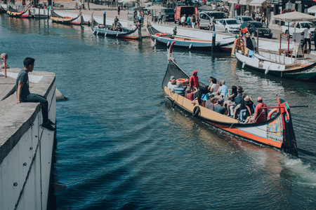 Canal Avairo Man on the verge watching gondola, Portugal