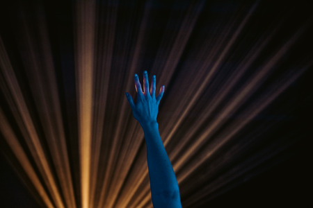 hand in the disco lights at the music festivalの写真素材