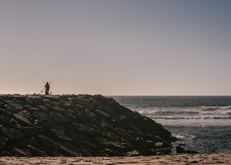 Fisherman at ocean coast, Costa Novaの写真素材