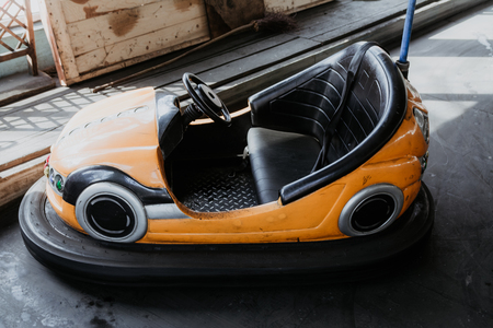 Amusement park - yellow toy car for funの写真素材