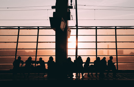 Sunset silhouette people railway station, cables, shadow