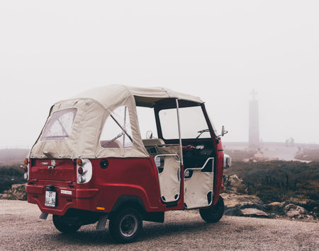 tuk-tuk in fog at cabo da roca, Portugal