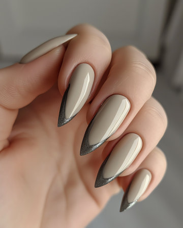Female hand with gray nail design. Nail polish manicure.の素材