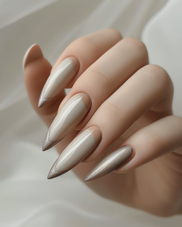 Female hand with silver nail design. Nail polish manicure.の素材
