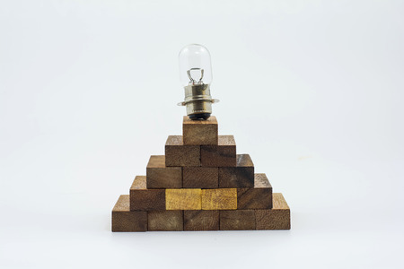 Lamp on top block stairs build in a pyramid shape  It is isolated on a white background の写真素材
