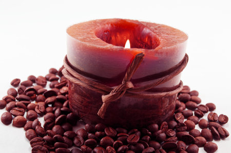 aromatherapy candle with coffee on white backgroundの写真素材