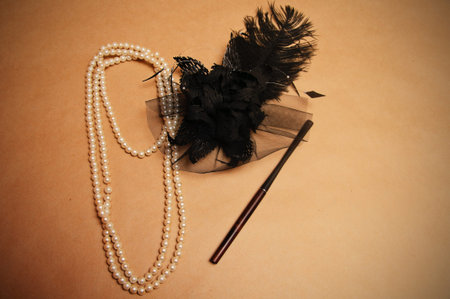 retro hair ornament from feathers necklace and a tube for cigarettes
