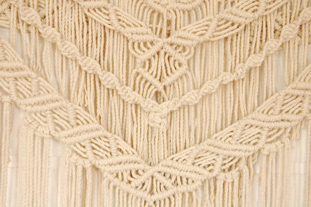 Macrame pattern. A minimal, stylish, trendy concept with a beautiful background with light neutral...