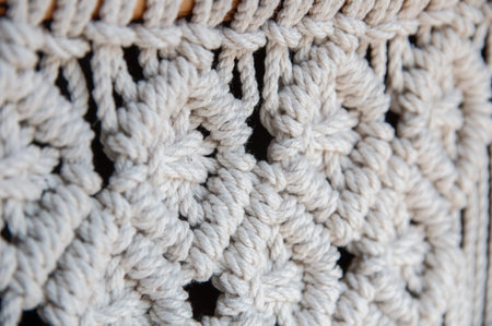 Close-up of hand made macrame texture pattern. Handmade stylish 100 cotton wall macrame decoration....