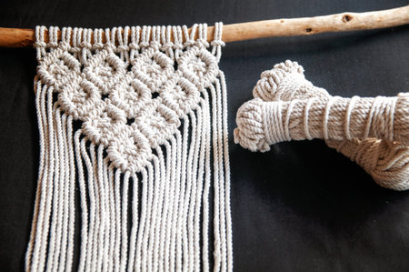 Decorative handmade stylish cotton macrame decoration, hobby interior for hanging on wall. DIY boho...