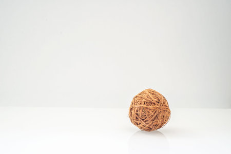 wicker ball from a vine natural colors on a light backgroundの写真素材