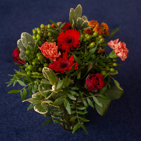 flower bouquet floristic of red gerberas, carnations and greenery professionally made close-upの写真素材
