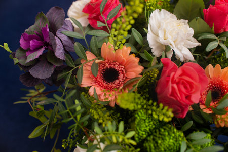 festive bouquet made by a professional florist, gerbera flowers, carnation rose, eucalyptus greeneryの写真素材