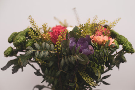 Beautiful flower arrangement close-up, a bouquet of mixed flowers from carnations in gerberas in a flower shopの写真素材