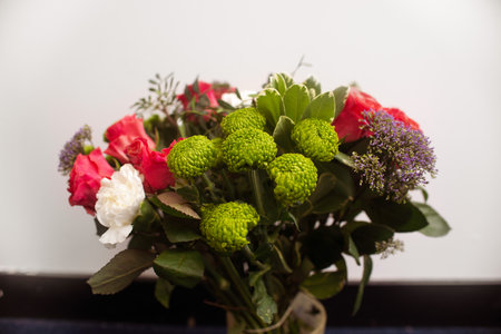 Gift flower arrangement close-up, a bouquet of mixed flowers in a flower shopの写真素材