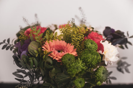 Beautiful floral arrangement bouquet composition, mixed flowers bouquet in floristの写真素材