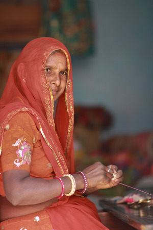 NIMAJ BAGH, INDIA Ð FEBRUARY 28: An unidentified woman inside the village of Nimaj Bagh, Rajasthan, Northern India on FEBRUARY 28, 2012. The village has just been opened up to boutique tourism.のeditorial素材