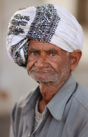 UDAIPUR, INDIA Ð MARCH 5: An unidentified man at the gate of the City Palace on the east bank of Lake Pichola in Udaipur, Rajasthan, Western India on MARCH 5, 2012.のeditorial素材