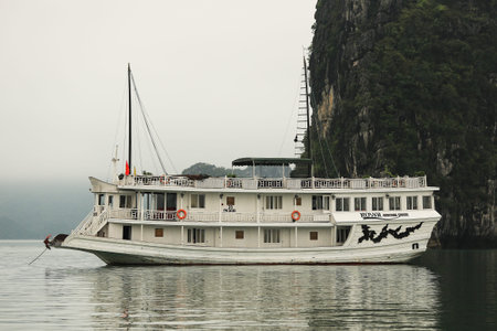 Halong Bay, Vietnam Ð April 10 2014: Floating Village in Halong Bay as seen from Vietnamese junk boat. Halong Bay is a UNESCO World Heritage Site and it is one of the prime travel destinations in Vietnam.のeditorial素材