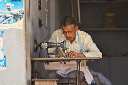 JAIPUR, INDIA Ð MARCH 4: An unidentified tailor at work in his street side shop on March 4, 2012 in...