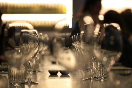 Wine glasses defocused in bar and restaurant and blurred background