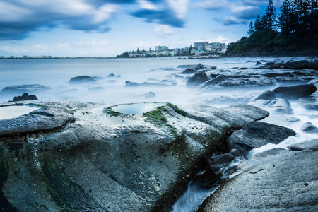 Long exposure sunrise over looking oceanの写真素材