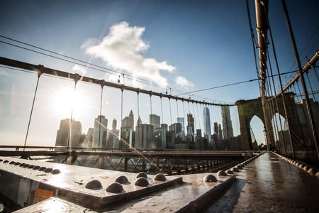 Skyline of downtown New York, Brooklyn Bridge and Manhattan in the afternoon sun light , New York City, USAの写真素材