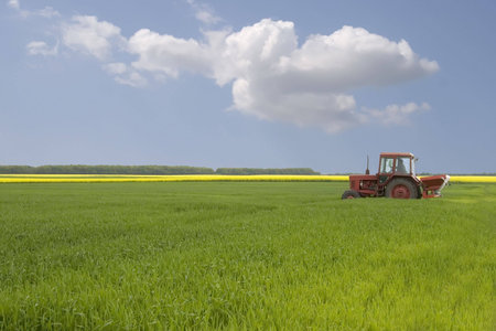 tractor on the grass fieldの写真素材